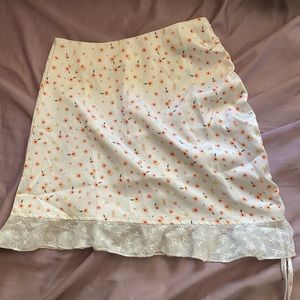 Pink side ruched skirt with pink and yellow flowers